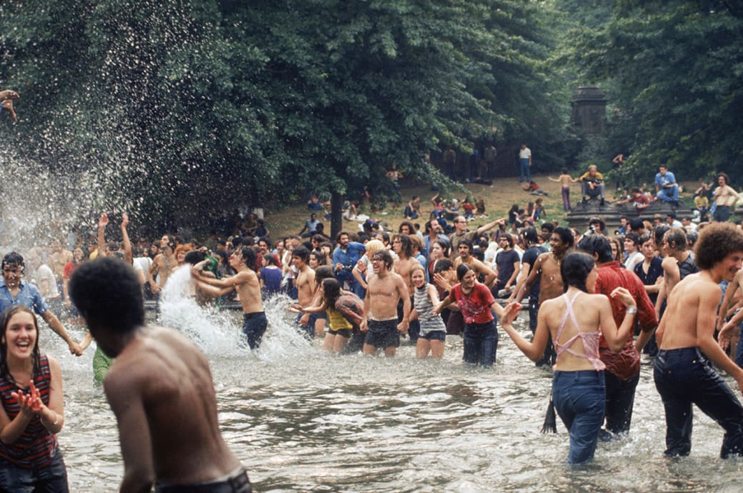 A crowd frolics in an unidentified lake in 1970.