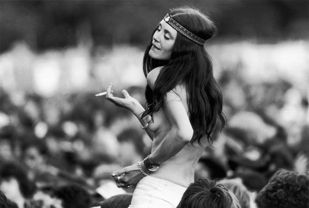 A topless woman enjoying the music of Led Zeppelin at the Knebworth Festival in the UK in 1979.