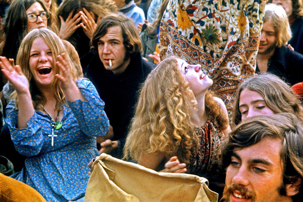 People in the crowd cheer as musical acts perform at the Altamont Speedway Free Festival on Dec. 6, 1969, in Livermore, California.