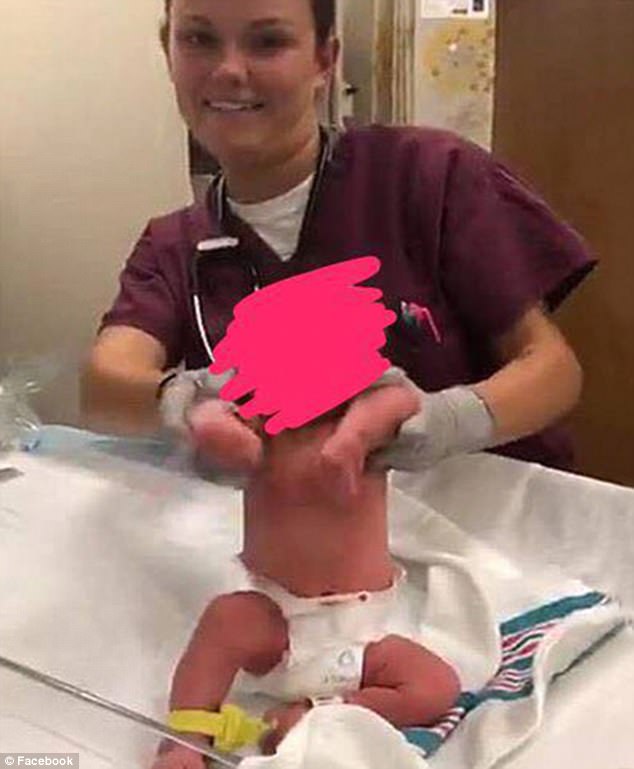 Two nurses have been removed from duty at Naval Hospital Jacksonville, in Florida, after uploading images of themselves messing around with newborns to Snapchat. This image was purportedly taken from a video that shows the nurse making the baby 'dance' to rap music