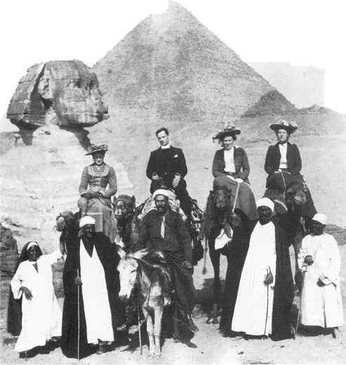 Group of people in front of Sphinx and Pyramid 1885