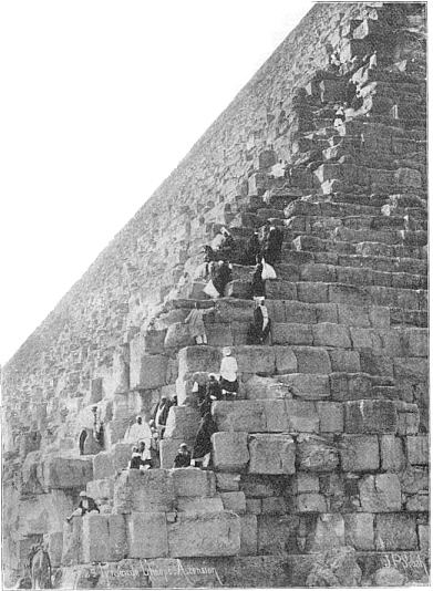 Tourists and guides climbing the Great Pyramid in the early part of the 20th century