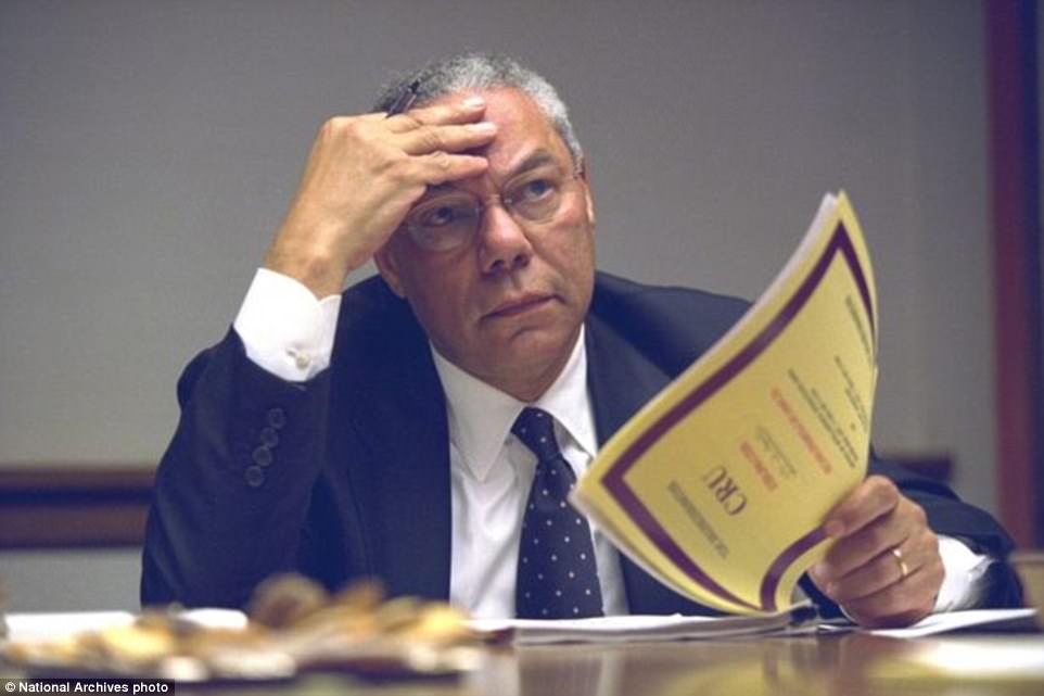 Then-Secretary of State Colin Powell gets briefed inside the President¿s emergency operations center